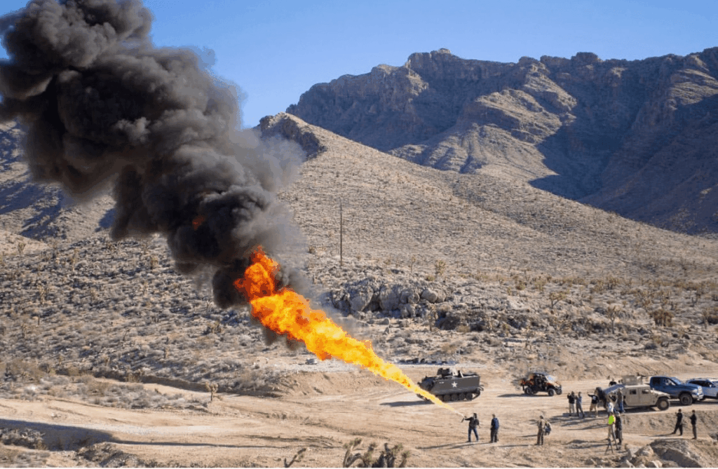 alt="Guest firing fully automatic machine gun from helicopter over Las Vegas"