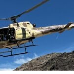 Tactical helicopter flying over the Mojave Desert during a 4th of July aerial shooting experience near Las Vegas.