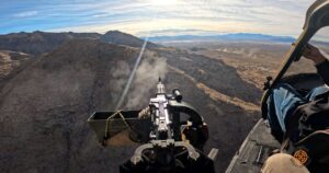 View from helicopter shooting fully automatic machine gun over Mojave Desert on an aerial adventure tour near Las Vegas to honor memorial day.