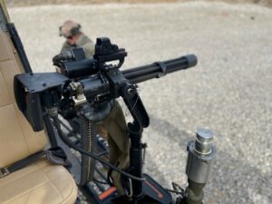 Mounted minigun on helicopter ready for the Door Gunner shooting experience with Gunship Helicopters