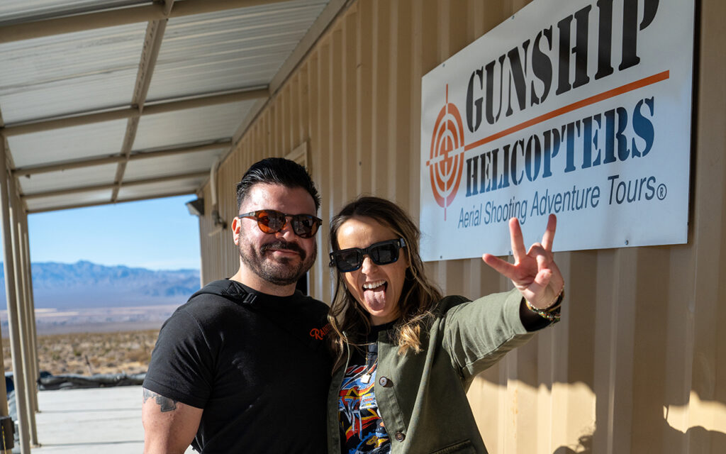 ultimate battle buddy - Happy couple poses outside Gunship Helicopters headquarters in Nevada desert