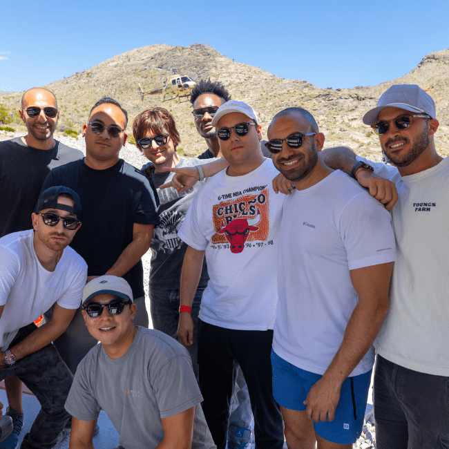 10 person package: Participants firing from helicopter in military-style shooting experience on ground