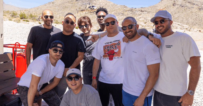 Bachelor party group posing after aerial shooting adventure with Gunship Helicopters in Las Vegas.