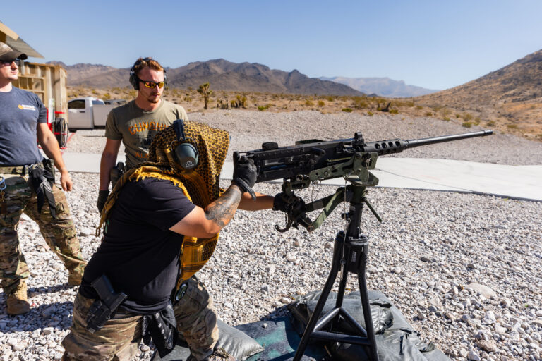 Guest feels the power of the Barrett .50 caliber at Gunship Helicopters’ outdoor shooting range in the Mojave Desert, guided by veteran range safety officers.