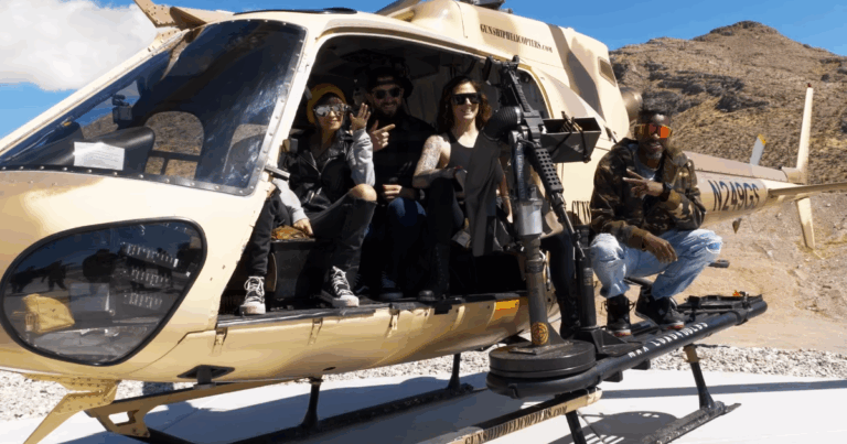 Group posing inside helicopter before aerial shooting adventure at Gunship Helicopters in Las Vegas.