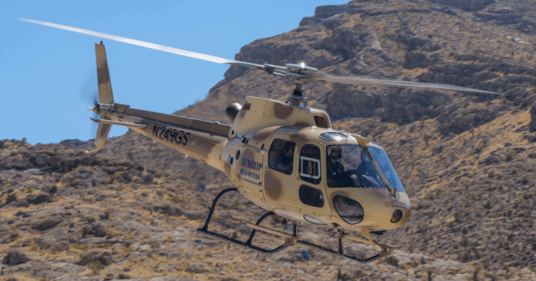 Gunship Helicopters aircraft flying over Mojave Desert during veteran-approved aerial shooting experience in Las Vegas