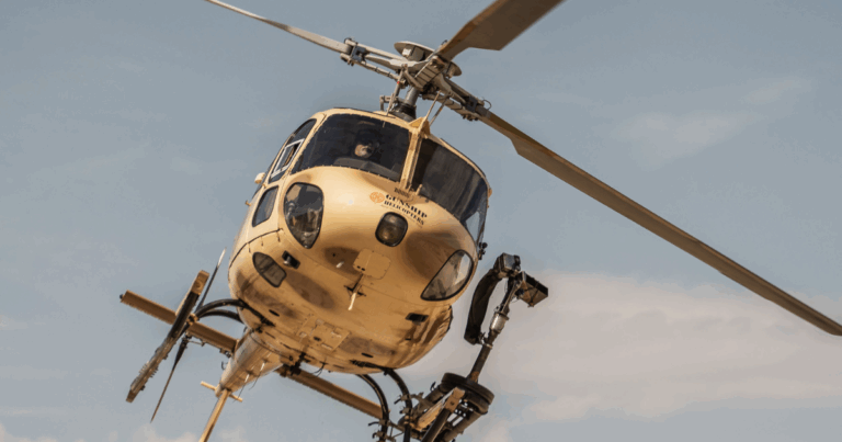 Adrenaline filled aerial shooting adventure in Las Vegas – guest firing fully automatic machine gun from open-door helicopter over Mojave Desert