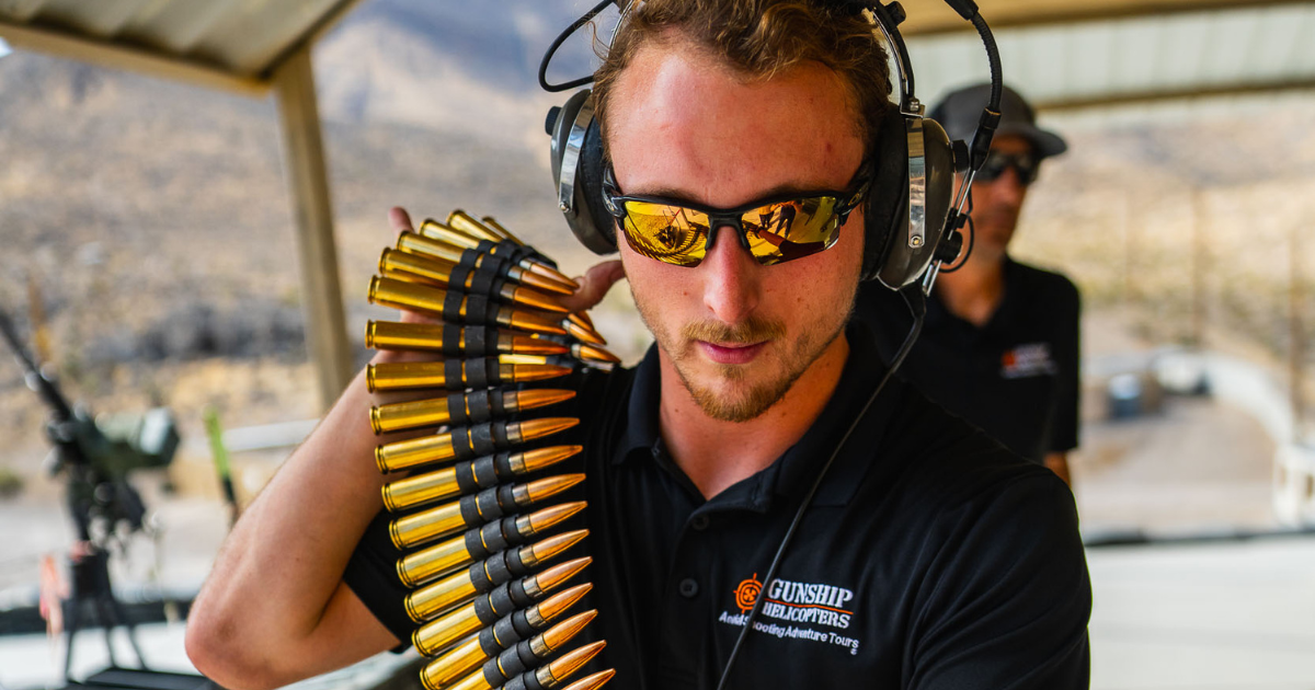 Gunship Helicopters veteran preparing ammunition at Mojave Desert range for helicopter adventure in Nevada