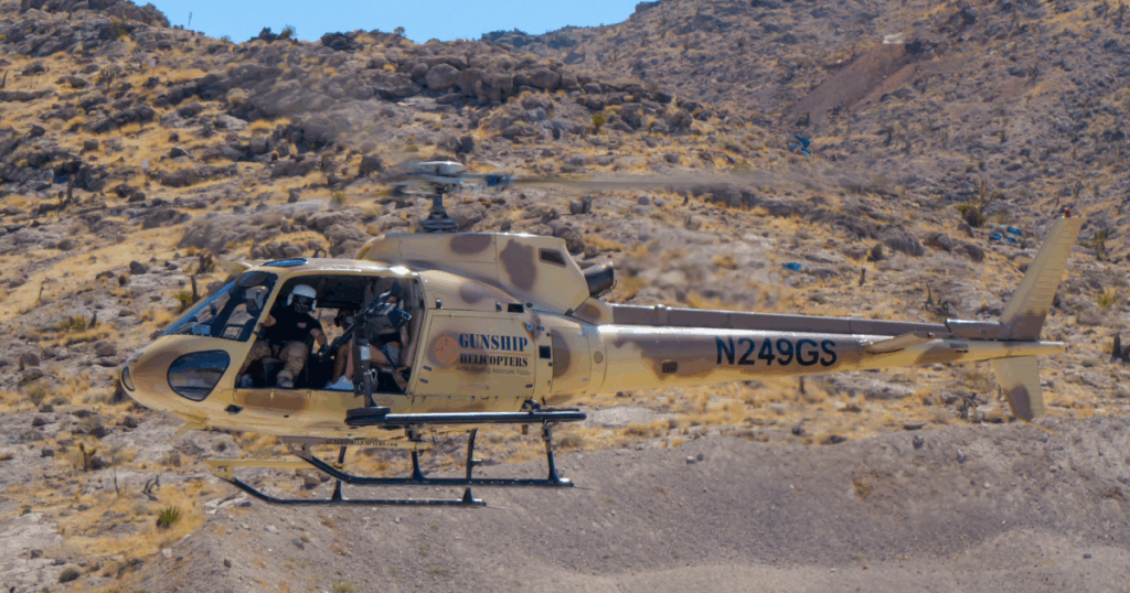 Veteran-led helicopter in flight during Gunship Helicopters aerial shooting adventure near Las Vegas Nevada