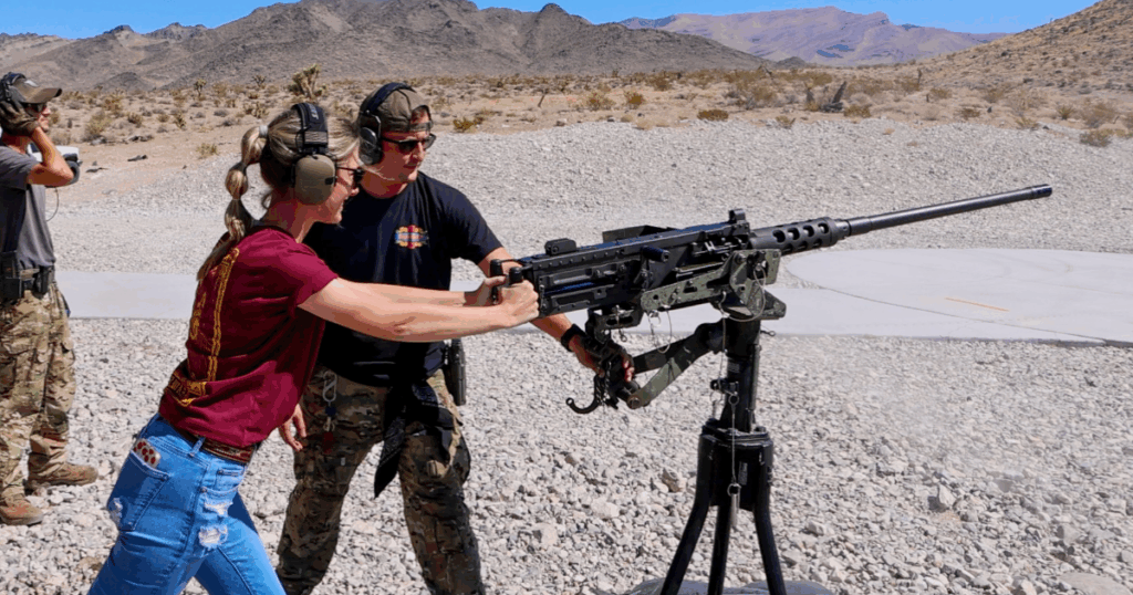 Range safety officer guiding guest through firearm safety protocols at Gunship Helicopters near Las Vegas Nevada