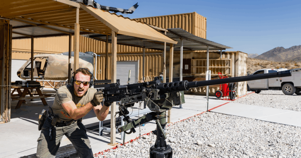 Veteran instructor guiding guest at Gunship Helicopters ground shooting range near Las Vegas, Nevada