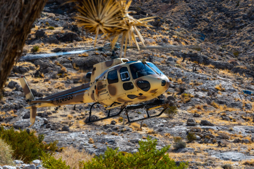 Gunship Helicopters aircraft flying over the Nevada desert during controlled rotorcraft operations for aerial shooting safety