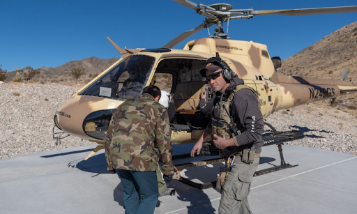 Veteran helicopter pilots and safety personnel prepare for flight at Gunship Helicopters, combining aviation expertise with military experience in Las Vegas.