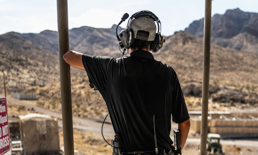 A veteran range safety officer monitors operations at Gunship Helicopters, bringing military experience and leadership to Las Vegas adventure tourism.