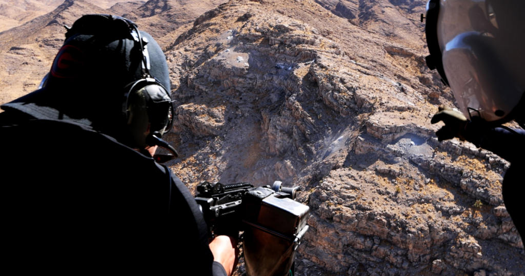 Aerial shooting Nevada experience from a helicopter over desert terrain for a Las Vegas bucket list adventure