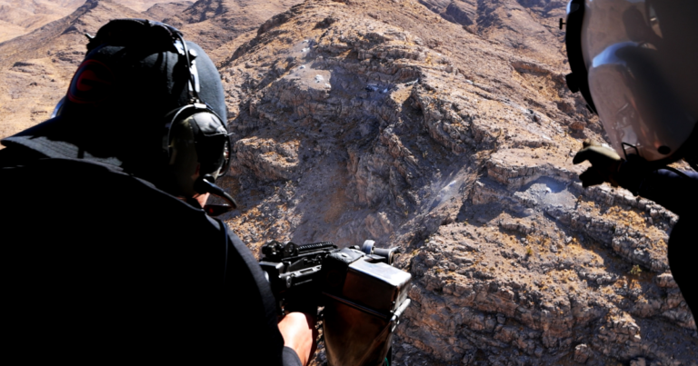 Aerial shooting Nevada experience from a helicopter over desert terrain for a Las Vegas bucket list adventure