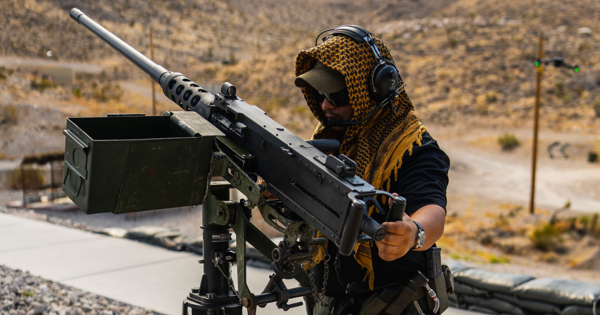 Gunship Helicopters team member demonstrating a mounted machine gun at a veteran-friendly shooting range near Las Vegas