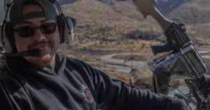 Open-door helicopter shooting adventure over the Nevada desert during a Las Vegas aerial shooting experience