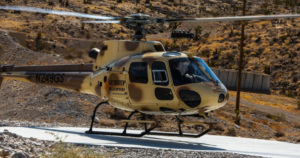 Gunship Helicopters Nevada the aircraft preparing for a helicopter gunship Nevada experience before an aerial shooting adventure in the Nevada desert.